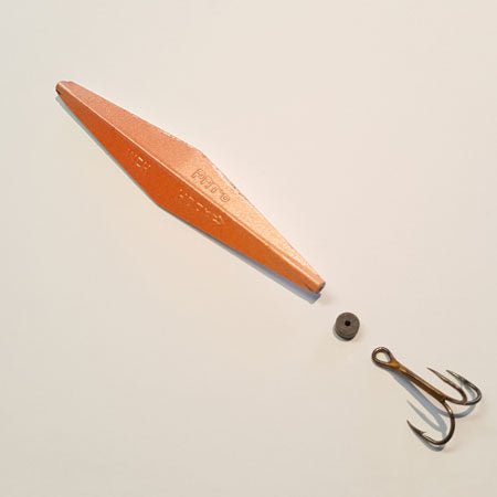 An orange fishing lure body with a treble hook 