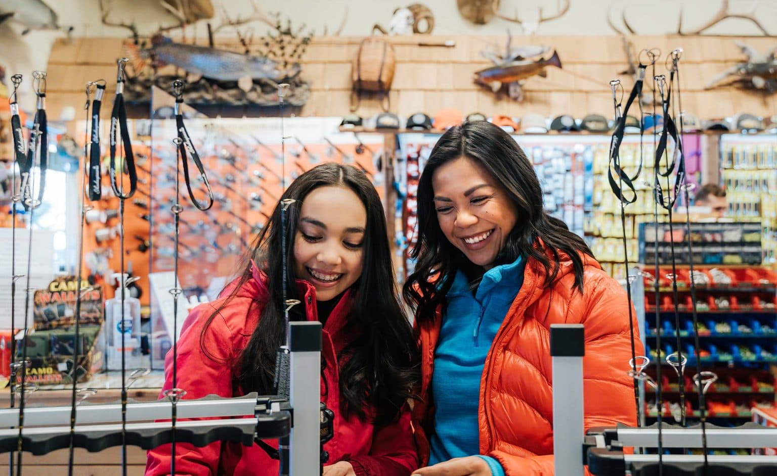 customers shopping for fishing equipment at wapiti sports 