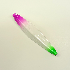 A  fishing lure blade featuring a vibrant pink-to-green gradient
