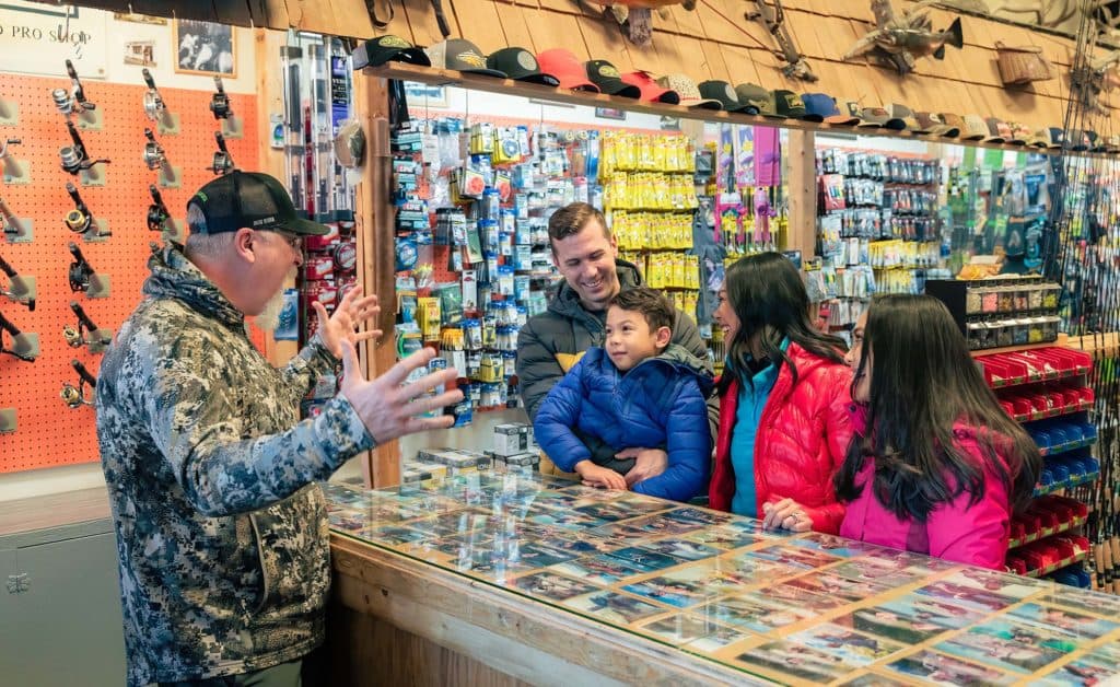 Nick with customers at the wapiti sports store in canmore